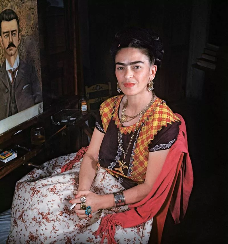 Frida painting her father Guillermo